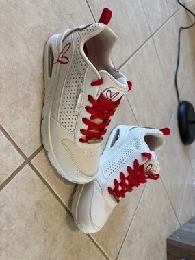 White Sneakers with Red Accents